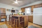 Fully equipped kitchen with center work island and snack bar